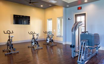 exercise room at mela's luxury apartments in san antonio
